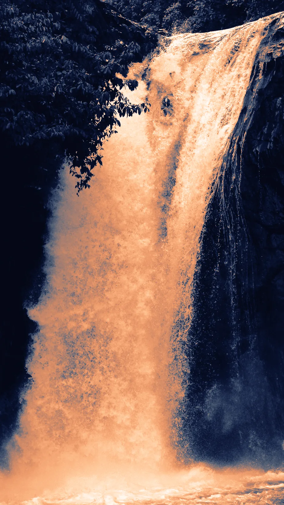 Josh Galt III riding a riverboard over the 15-metre Hollín Chico waterfall in Ecuador
