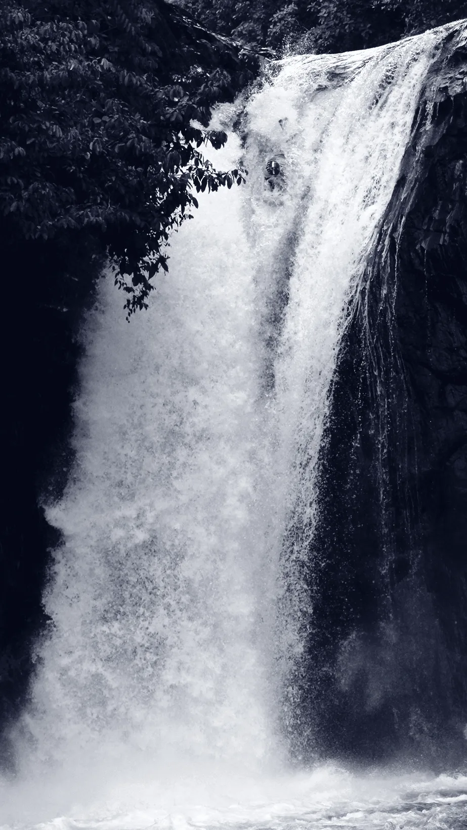 Josh Galt riding a riverboard over the 15-metre Hollín Chico waterfall in Ecuador